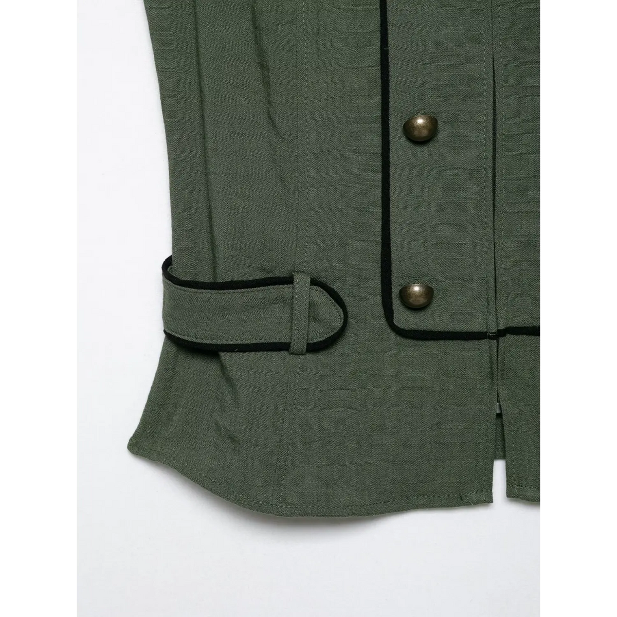 Close-up of side waist buckle strap detail, black piping edge on olive green halter vest, textured woven fabric