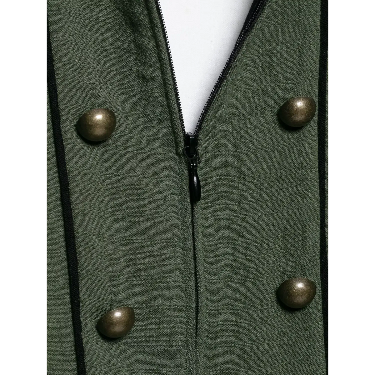 Macro closeup of front zipper and antique brass buttons on olive green halter waistcoat, black contrast piping