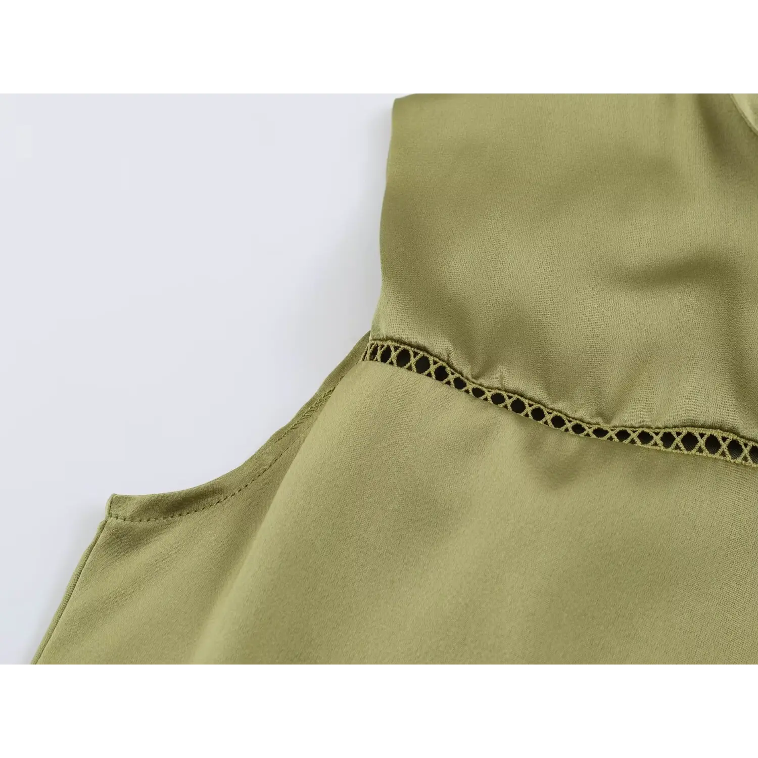 Side torso closeup, ladder hollow cutout stitching panel beside sleeveless arm opening