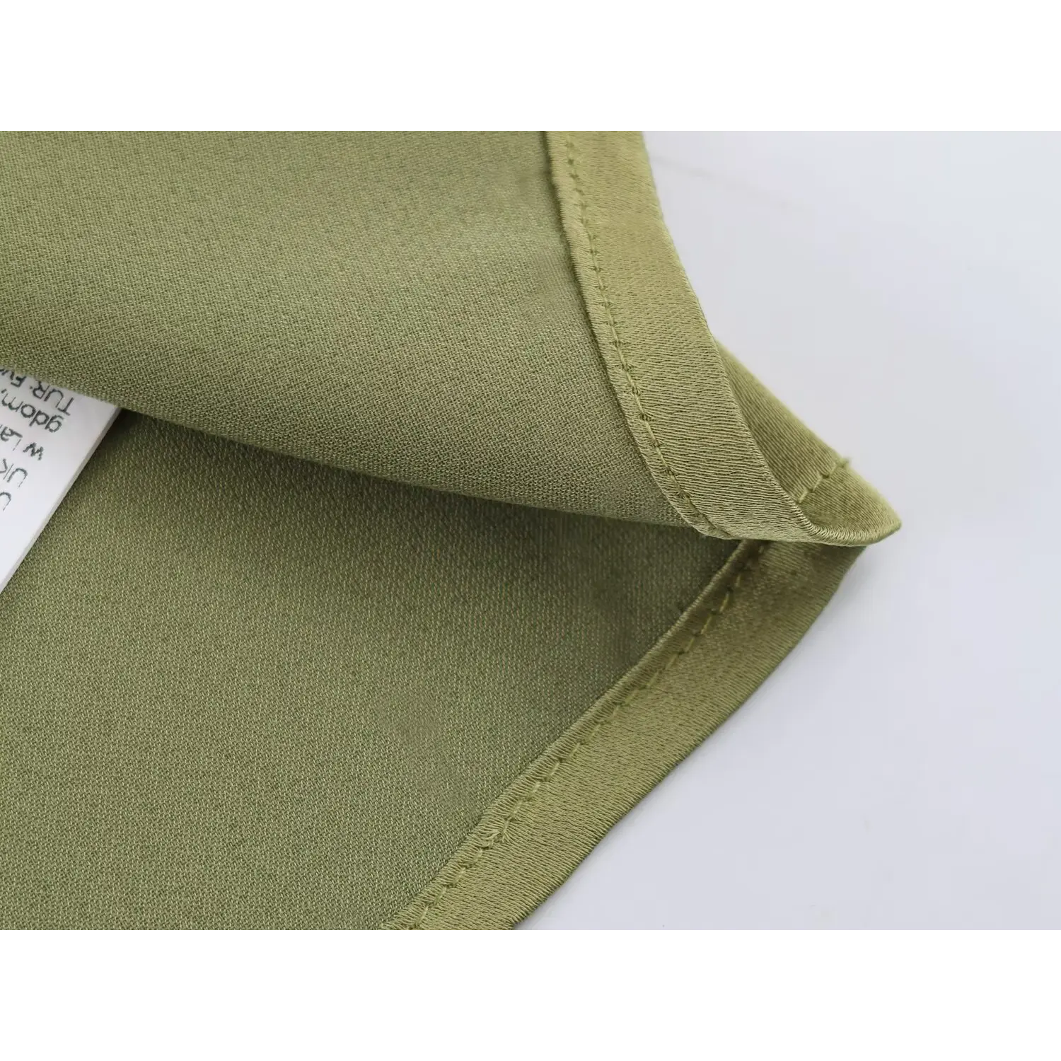 Folded hem shot showing full lining, double layer neat edge construction
