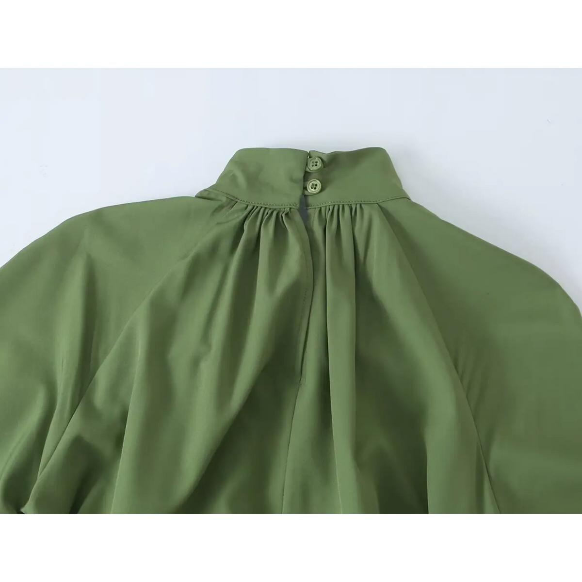 Close-up of back neck button closure