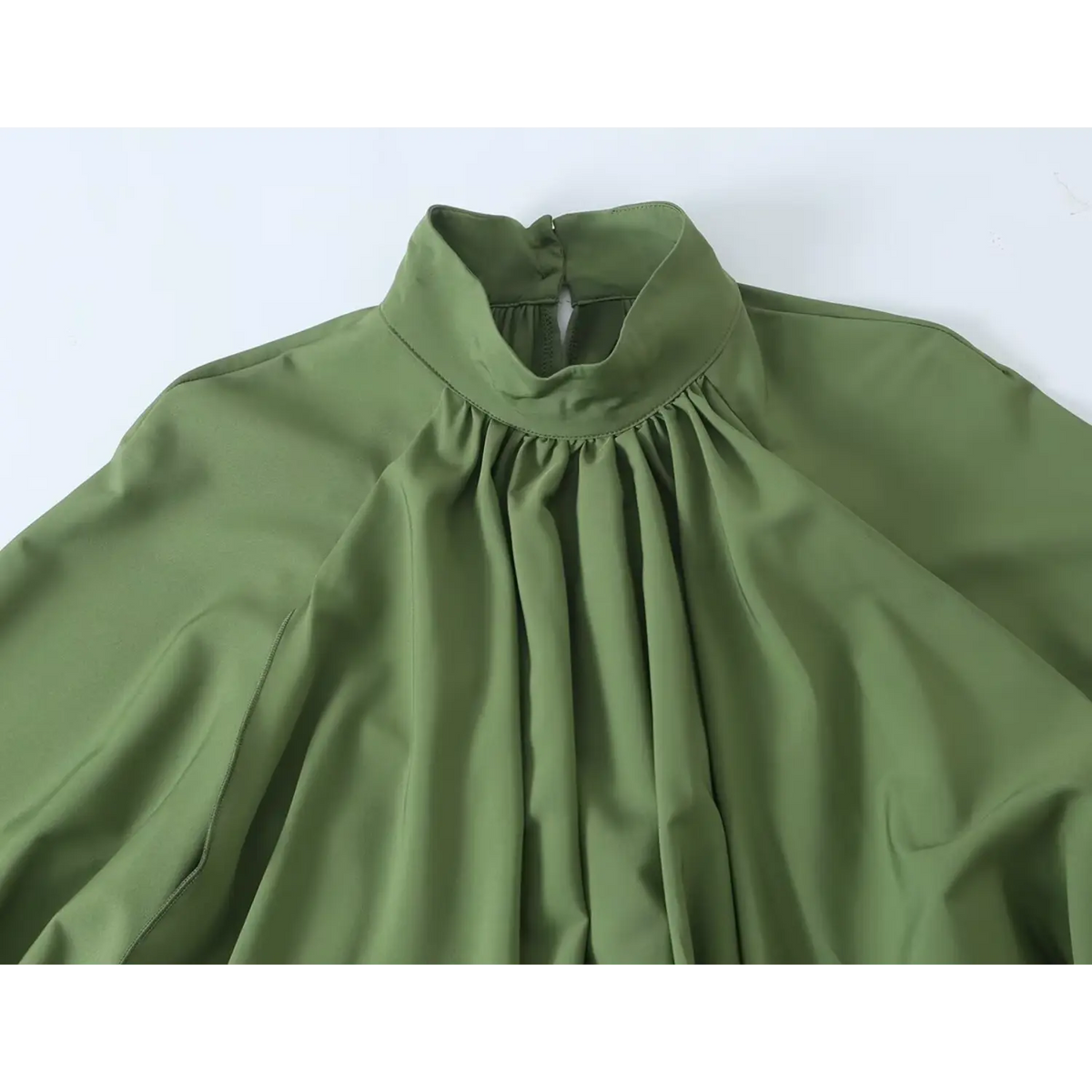 Close-up of stand collar and neckline gathering