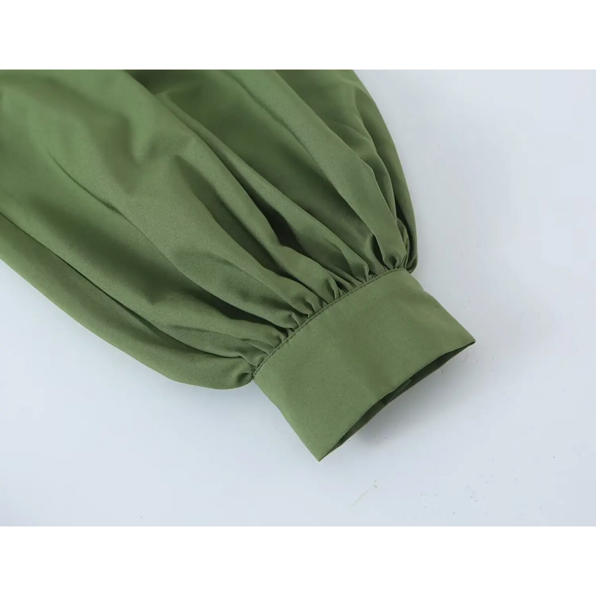Close-up of lantern sleeve button cuff