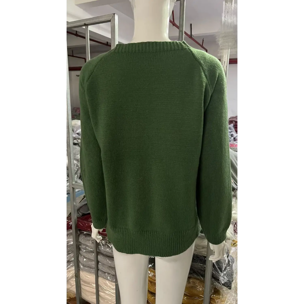 Back view of olive sheep intarsia crew neck knit sweater on mannequin