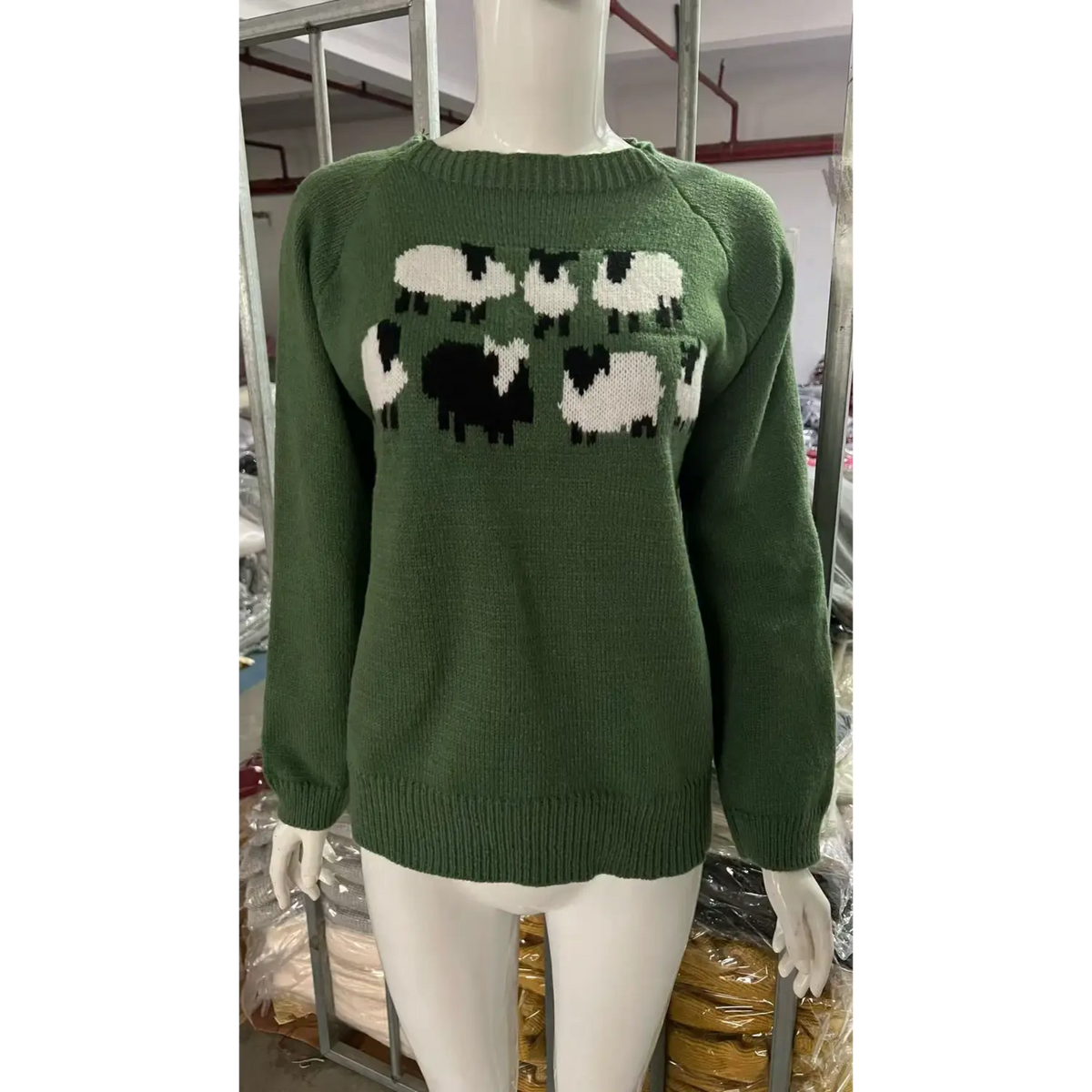 Front view of olive sheep intarsia crew neck knit sweater on mannequin