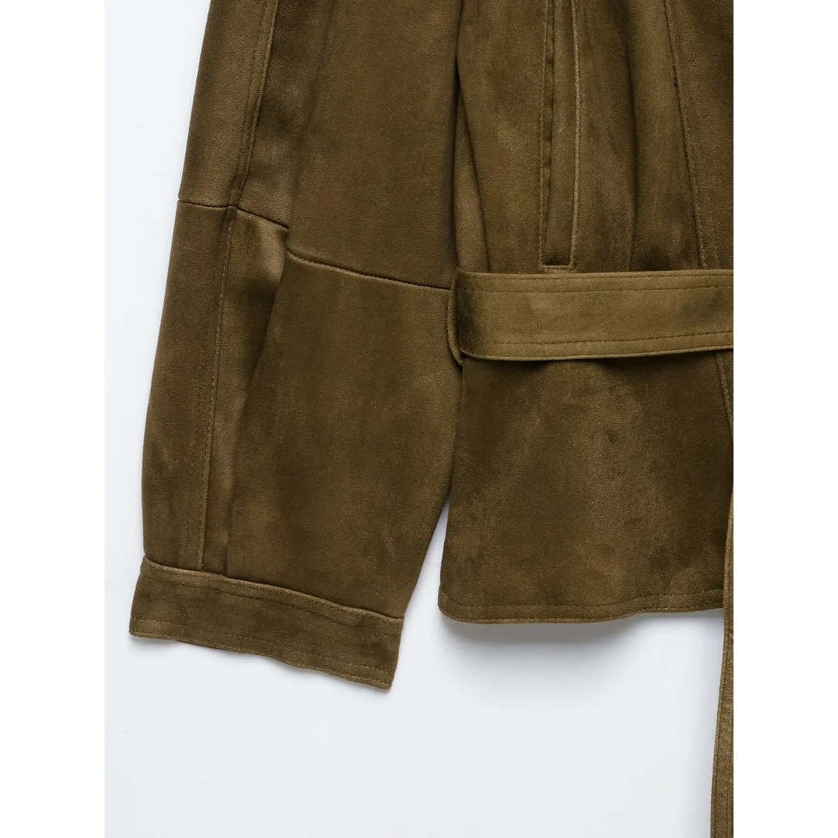 Close-up of belt, turned-up cuff and cropped hem