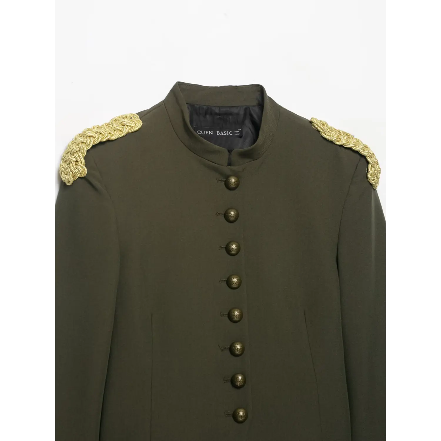 Front collar and antique embossed metal buttons close‑up on olive green cropped military blazer with gold epaulets