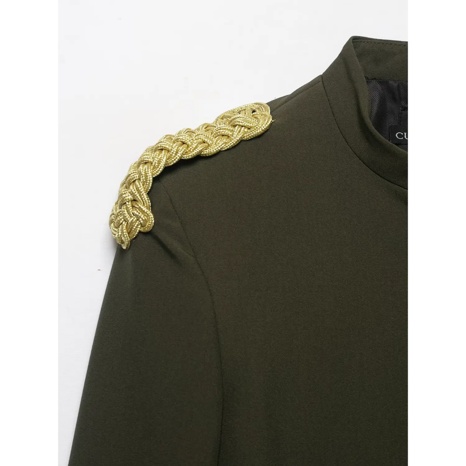 Close‑up of gold braided epaulet shoulder detail on olive green cropped military blazer