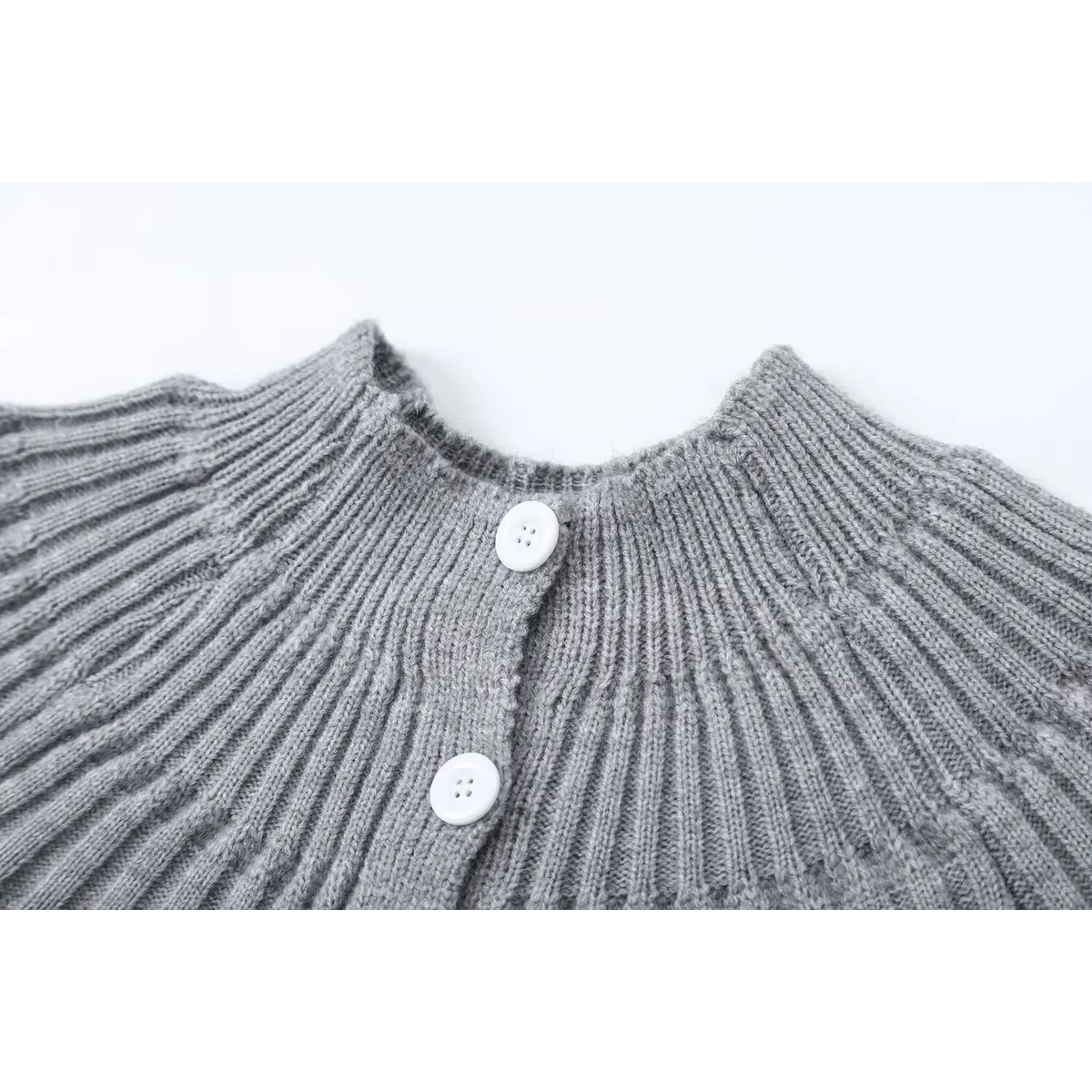 Close-up of gray ribbed collar and white buttons