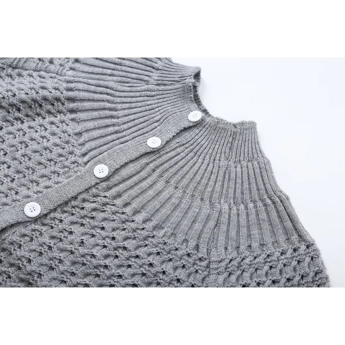 Close-up of gray ribbed yoke and button placket
