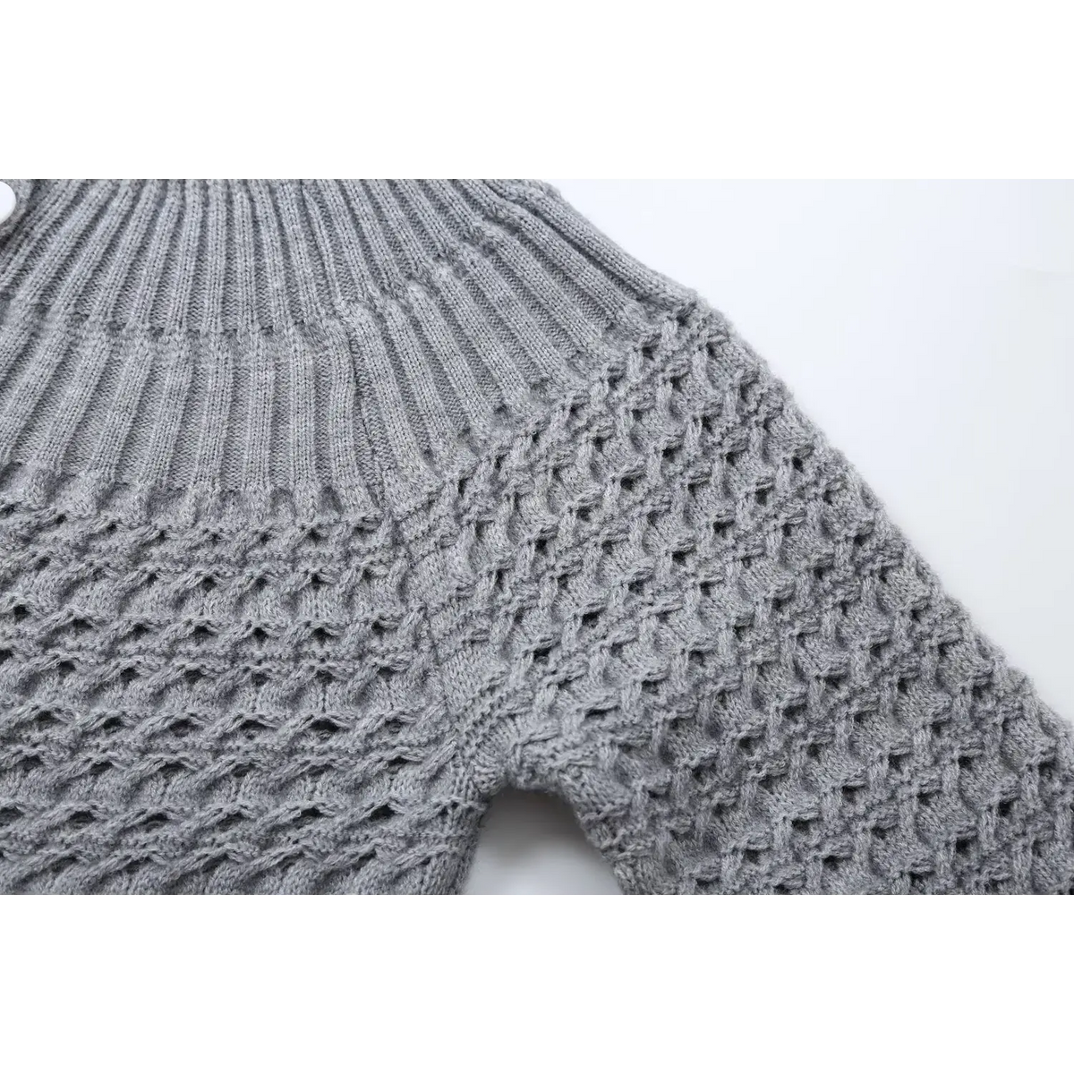 Close-up of gray openwork shoulder seam