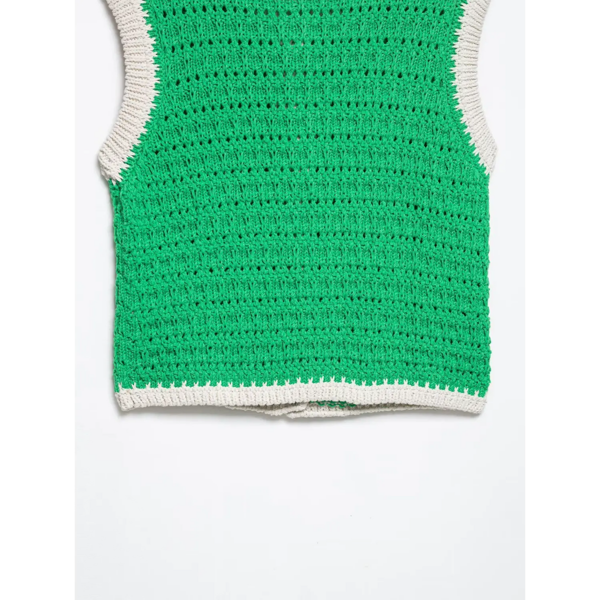 Close-up of green back hem
