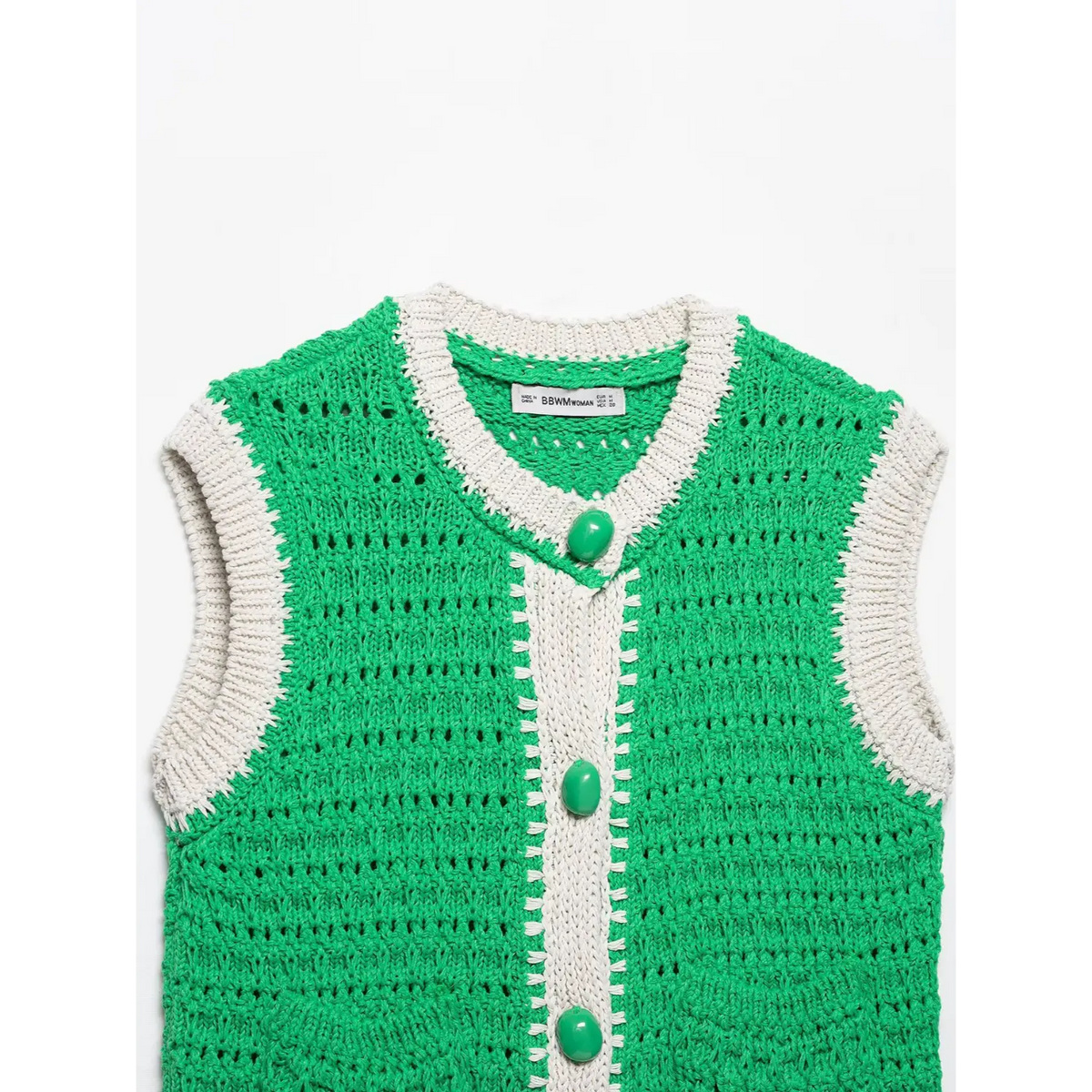 Close-up of green collar placket buttons and contrast trim