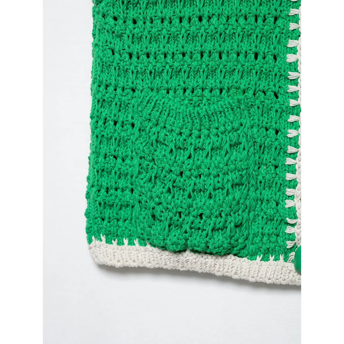 Close-up of green hem ribbed trim