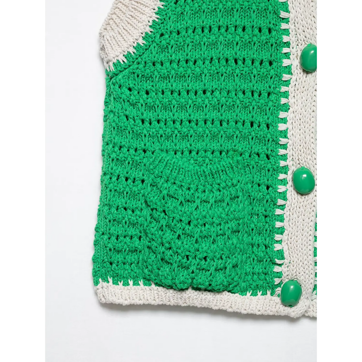Close-up of green hem and placket buttons