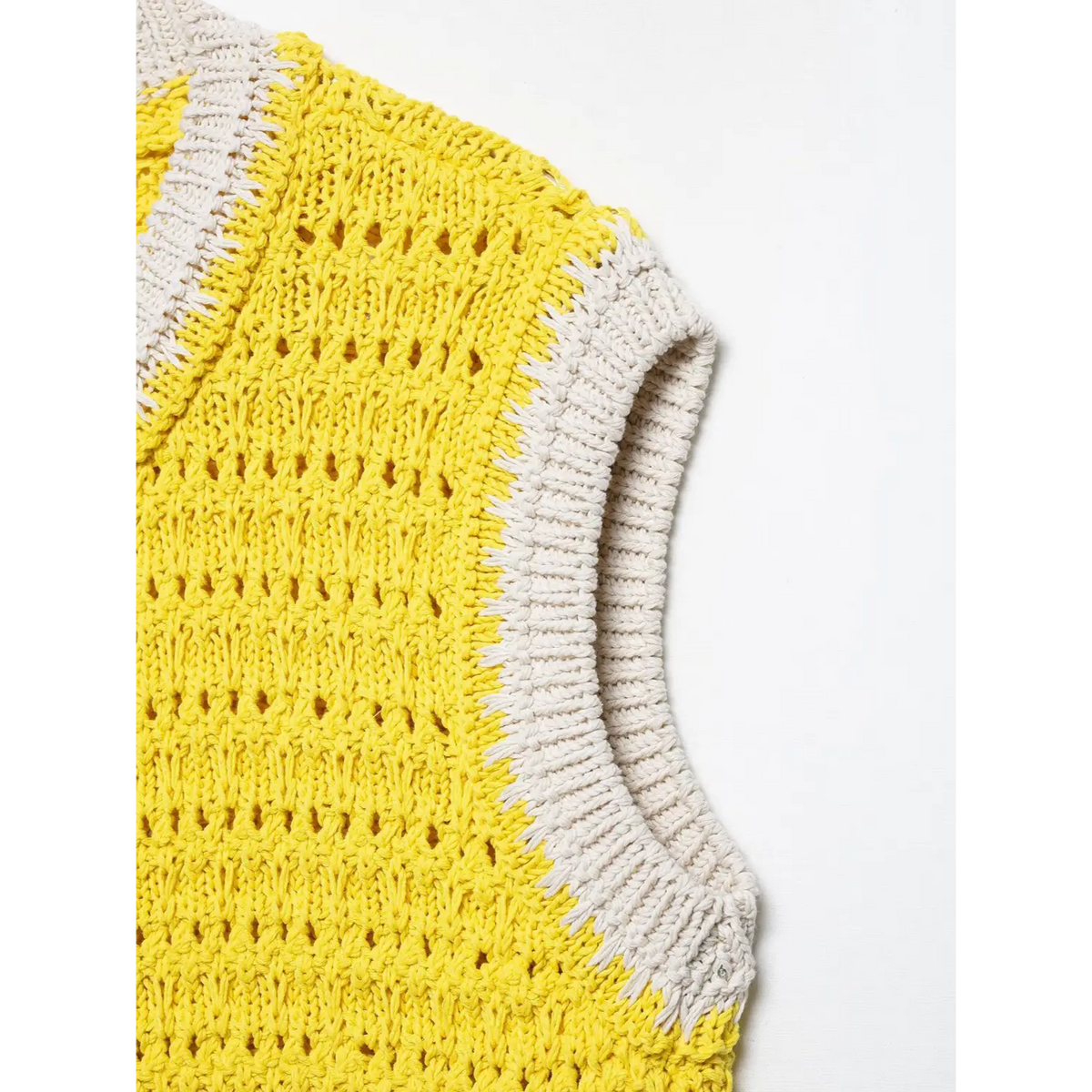 Close-up of yellow armhole contrast trim