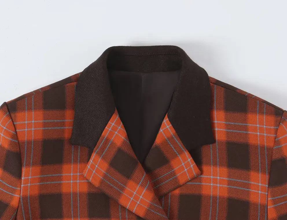 Close-up of contrast dark brown lapel and plaid notched collar