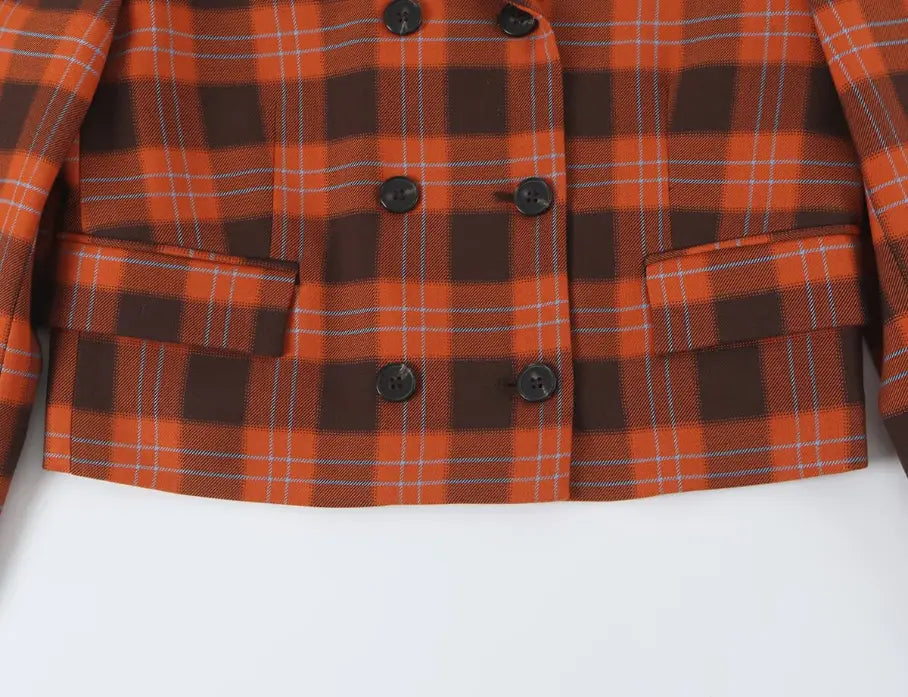 Close-up of cropped hem and double breasted buttons