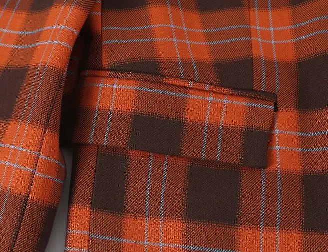 Close-up of flap pocket and plaid stitching