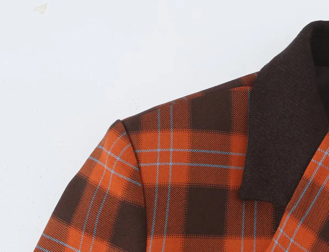 Close-up of shoulder seam and plaid fabric