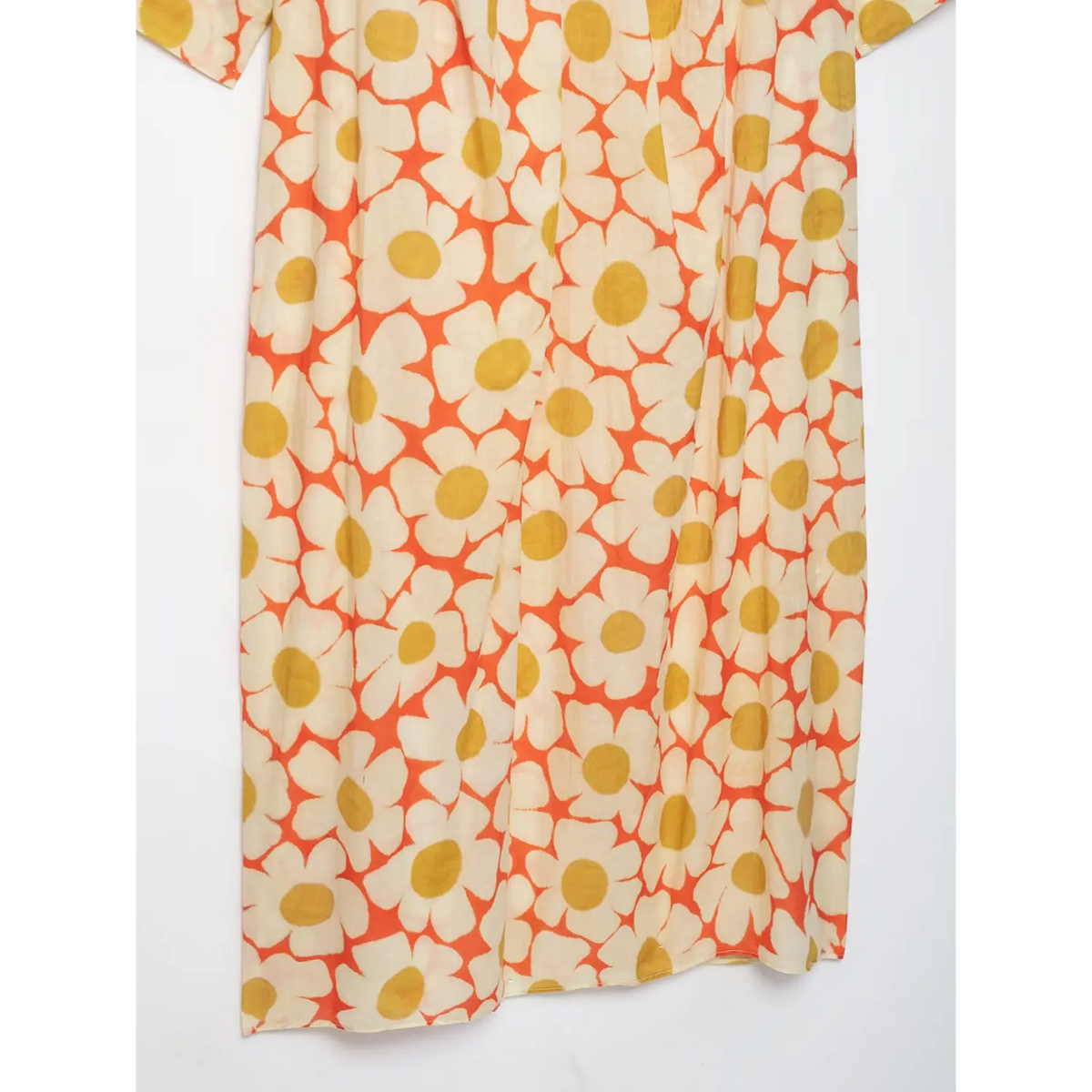 Full skirt flat shot of orange daisy floral print lightweight maxi dress