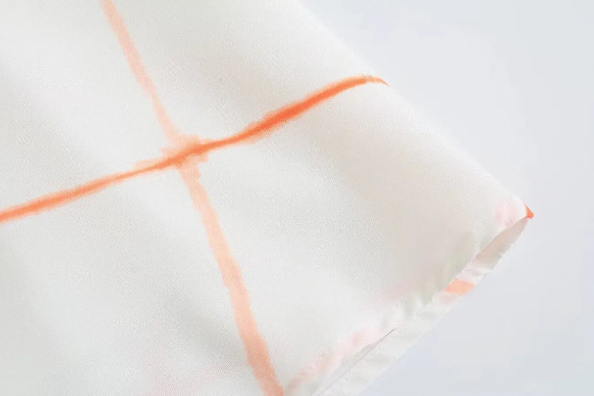 Close-up of mini hem stitching and grid print
