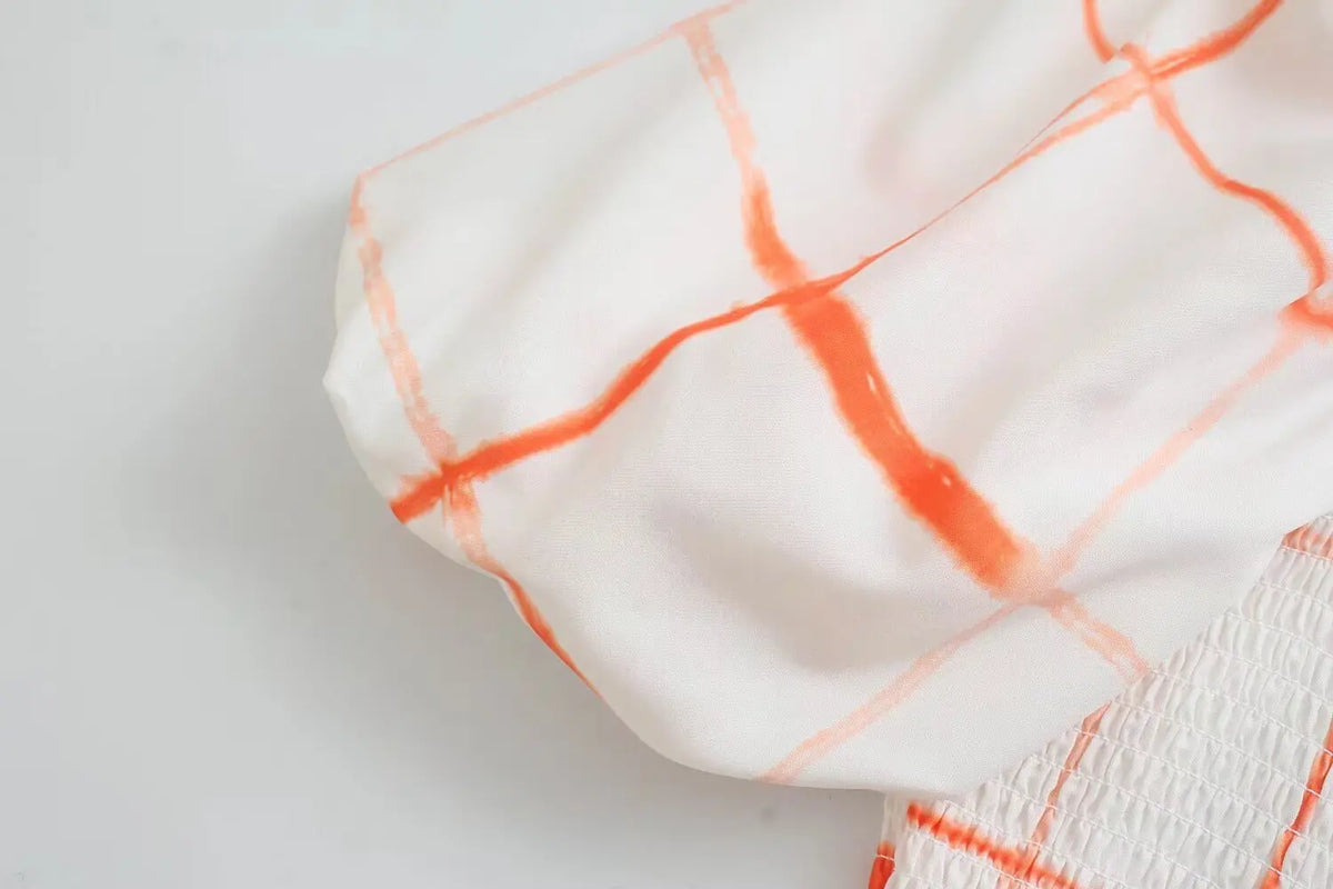 Close-up of puff sleeve volume and grid print
