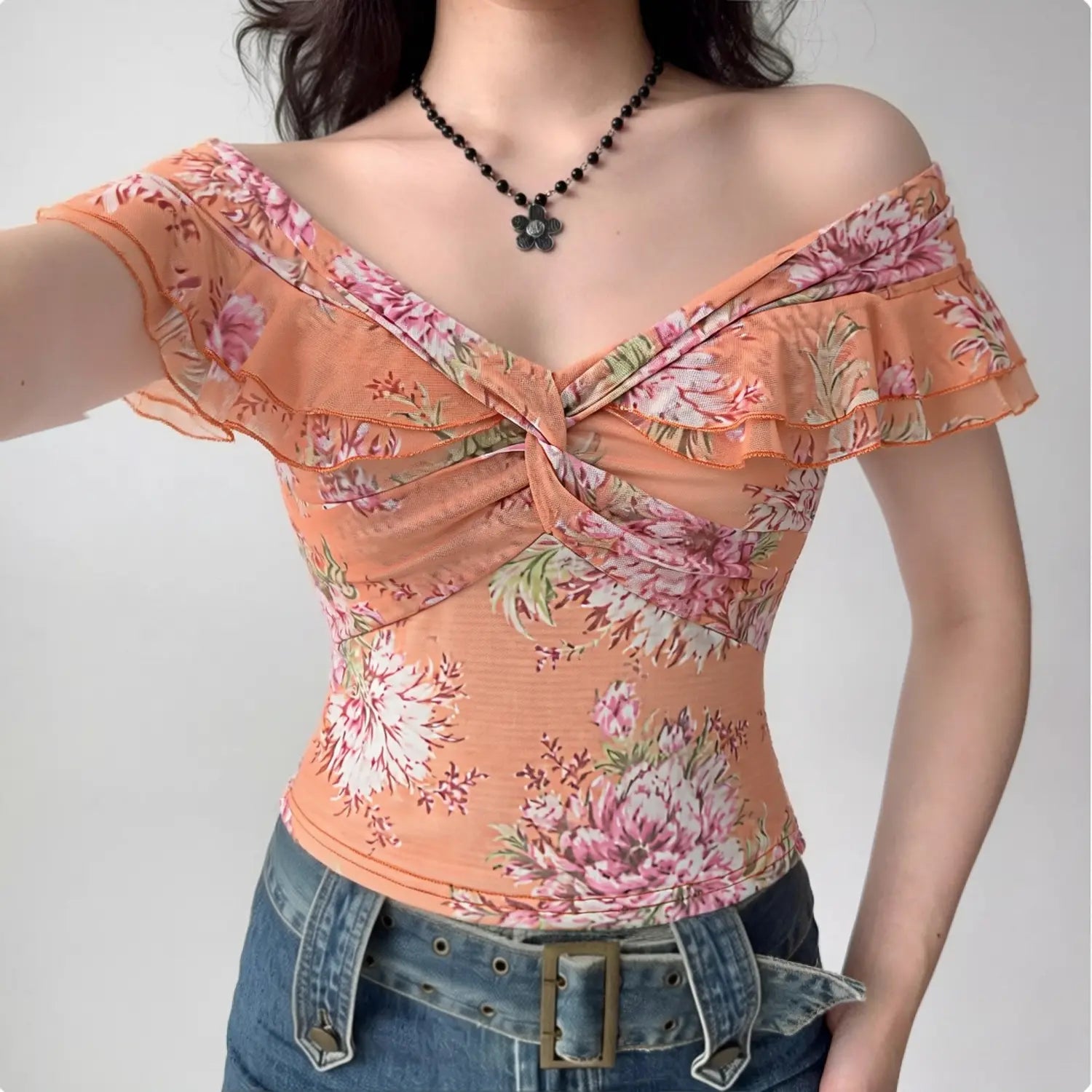 Orange pink gradient floral mesh off shoulder top half body model shot, double ruffle off-shoulder front twist cropped fit soft vacation slimming top shot