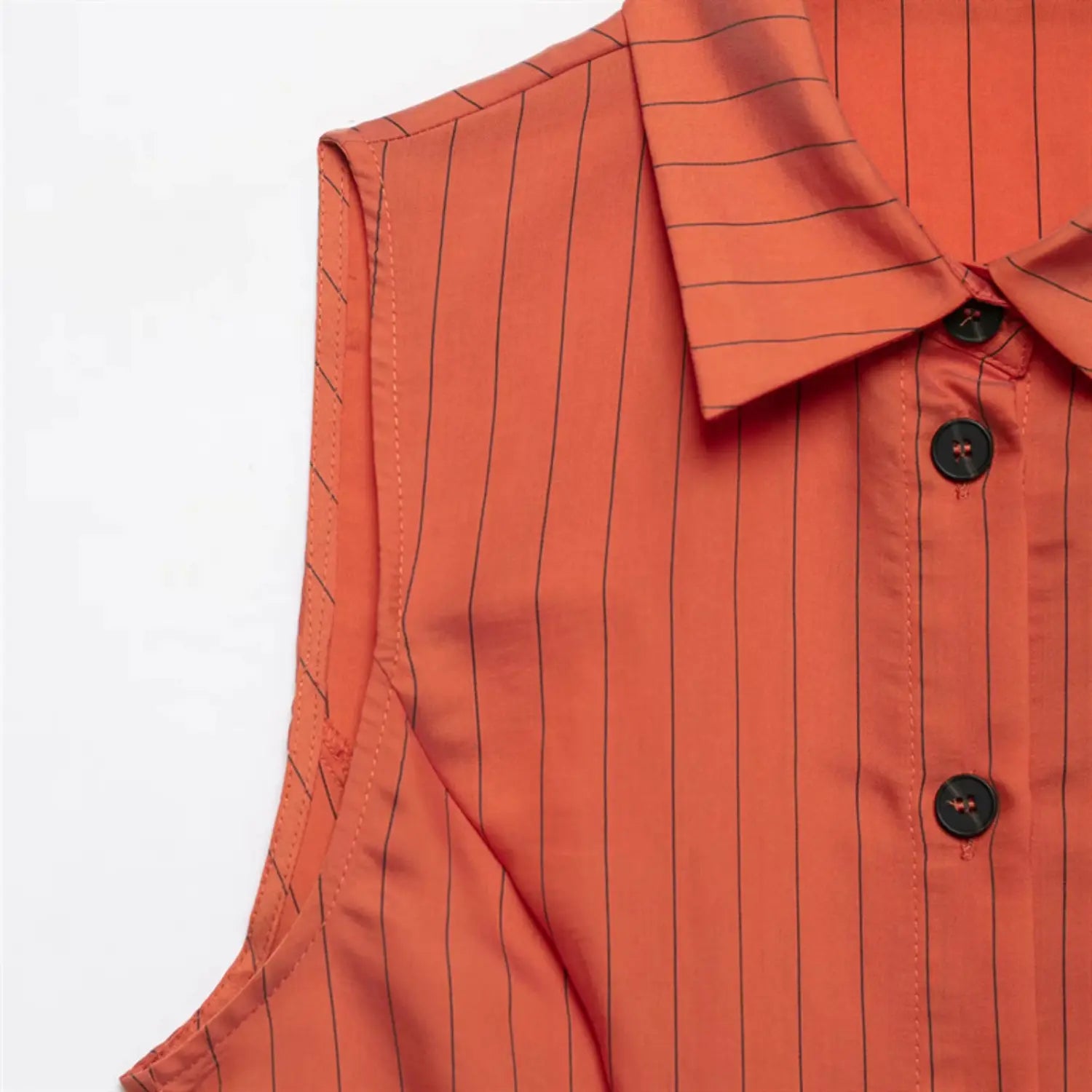 Side neckline and armhole close-up, turn-down collar edge, sleeveless armhole binding, fine vertical stripe print