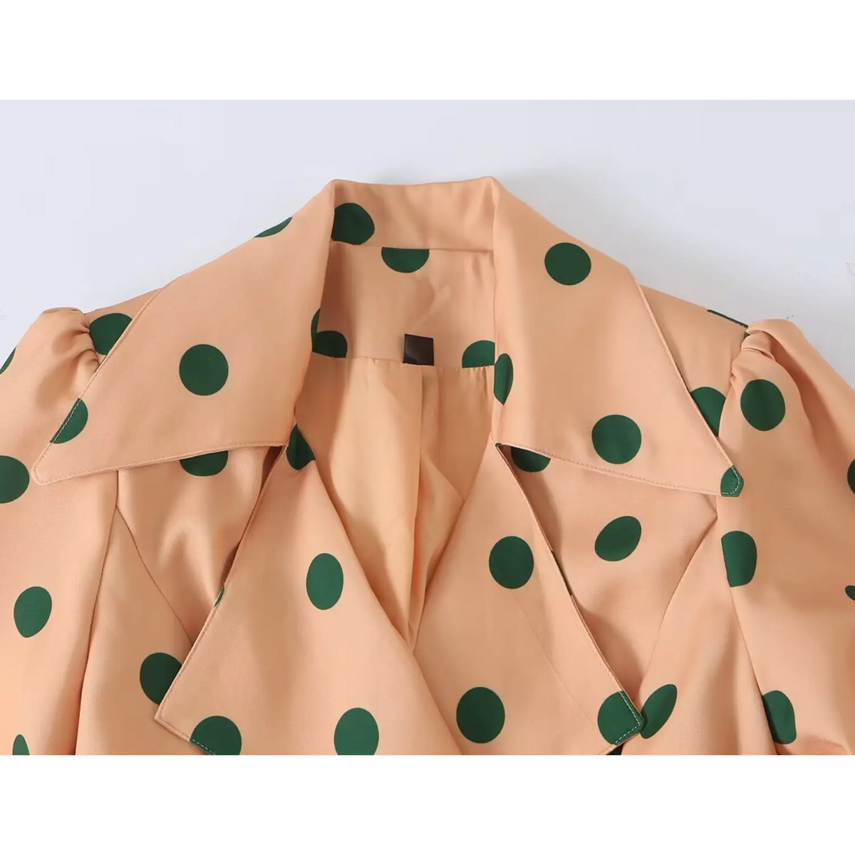 Close up of fabric texture for orange women trench coat