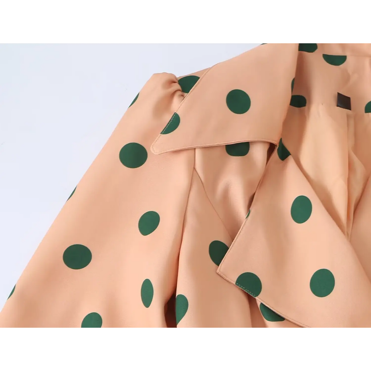 Waist belt detail shot of orange loose fit women trench coat