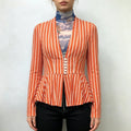 Model front wearing orange white striped v‑neck peplum blazer