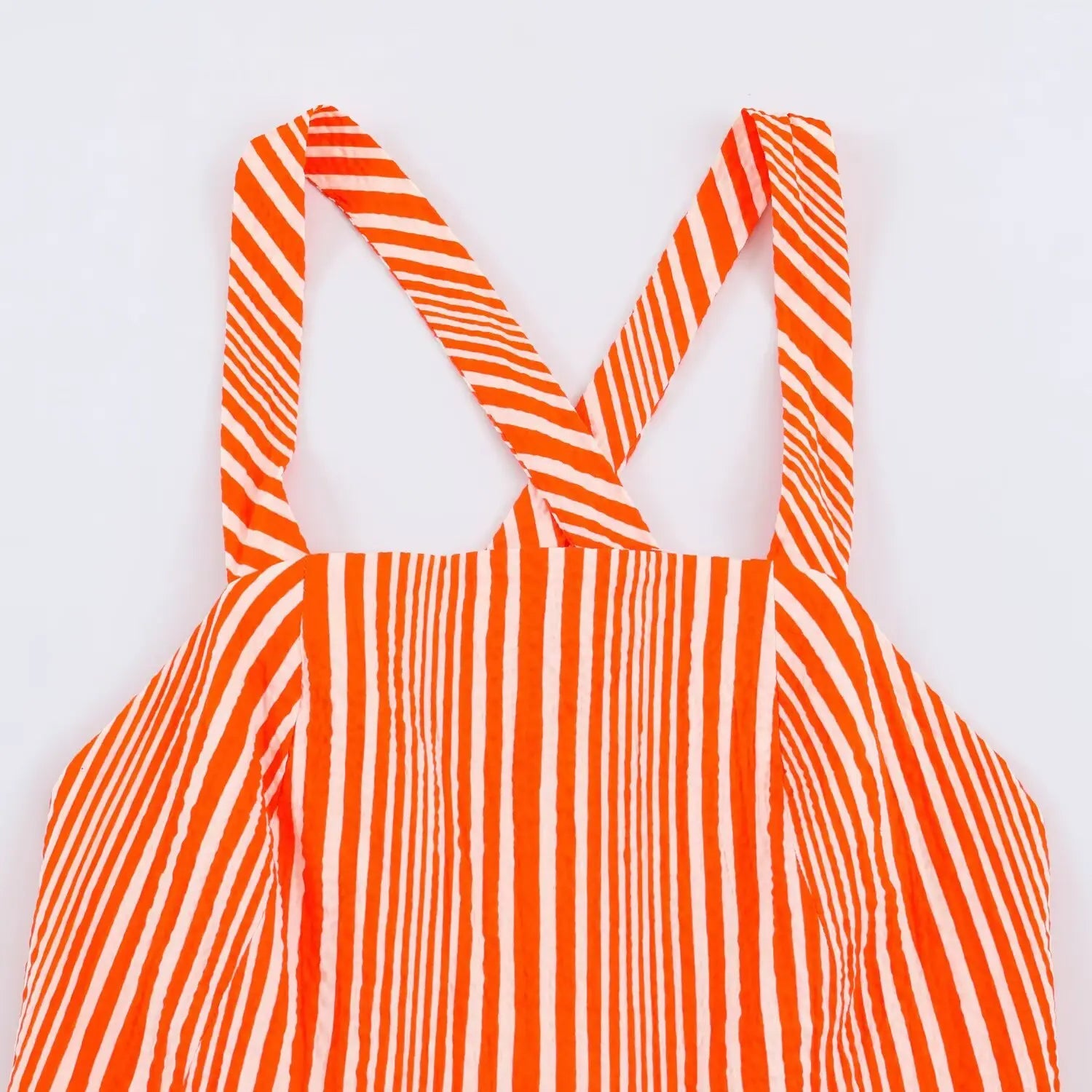 Top flat view of crisscross back strap bodice design
