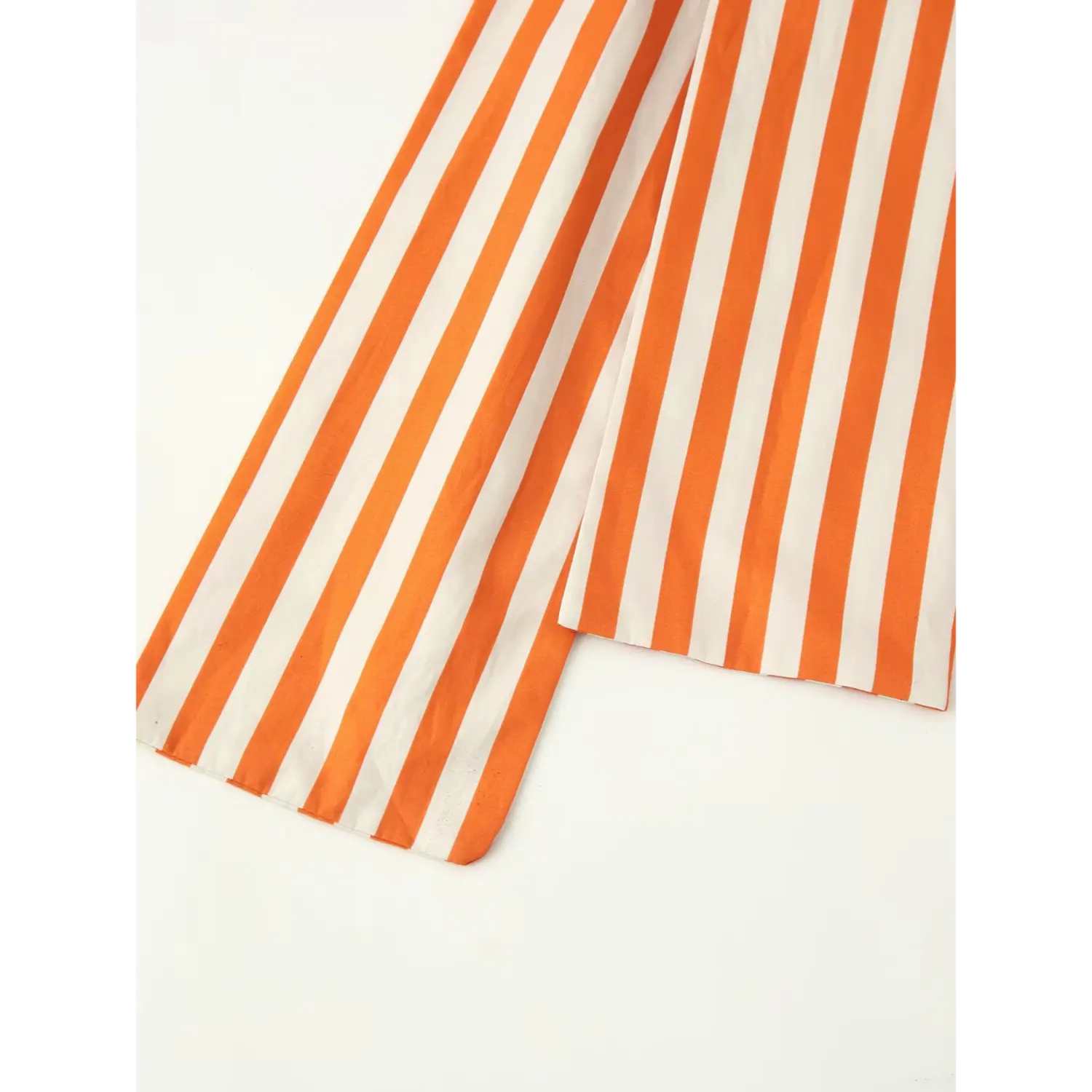 Flat lay close‑up of long orange‑white striped sash tie ends, straight finished fabric hem