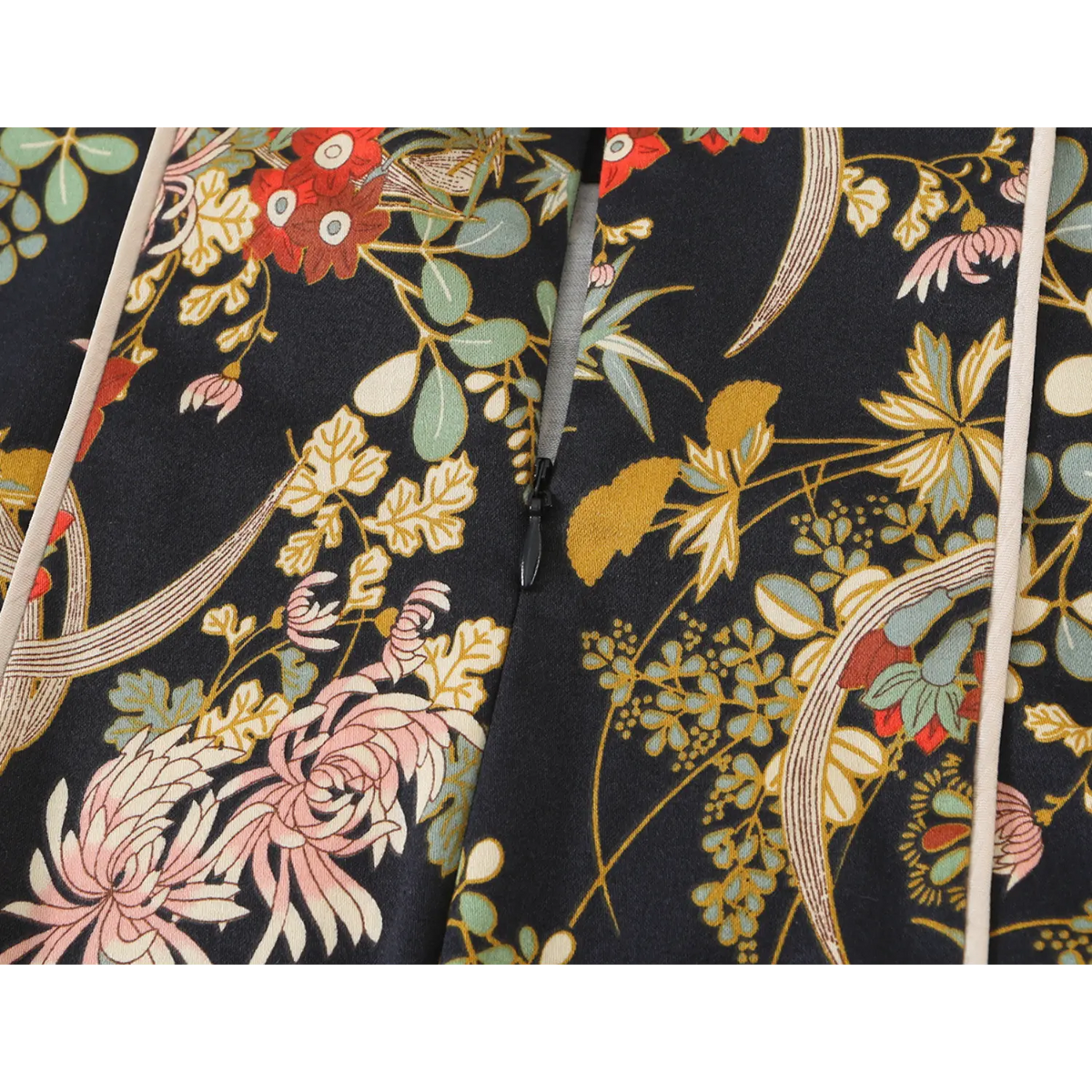 Close-up of back zipper on oriental floral print dress