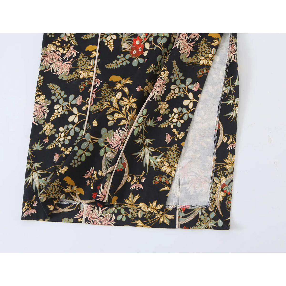 Close-up of hem slit and inner lining on oriental floral dress