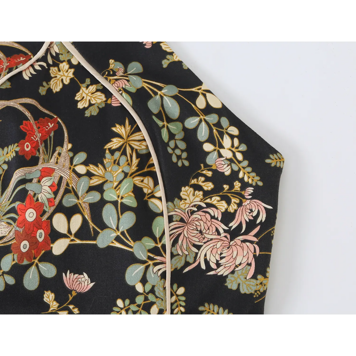 Close-up of shoulder and floral print on dark oriental dress