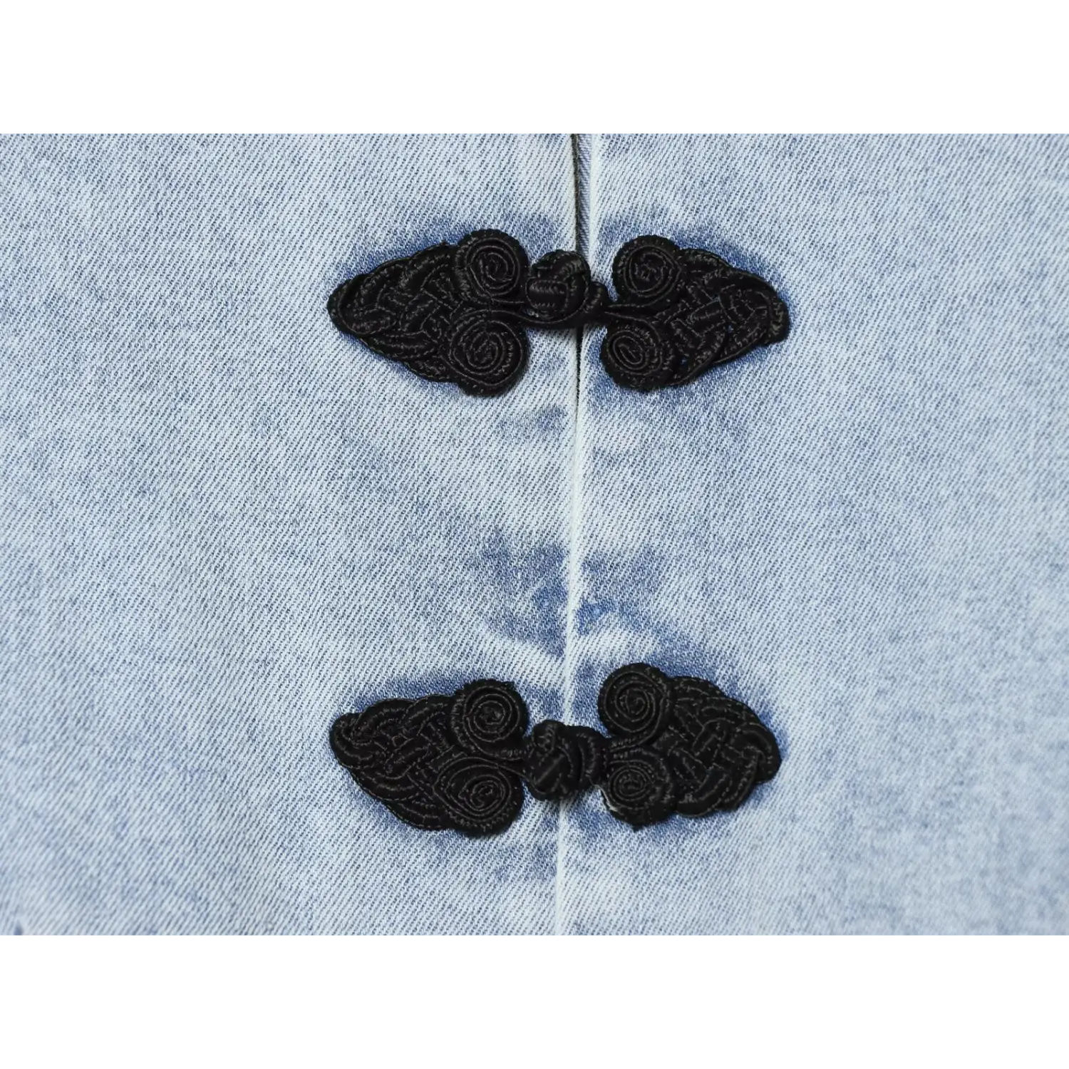 Extreme closeup embroidered cloud shape chinese frog knot button
