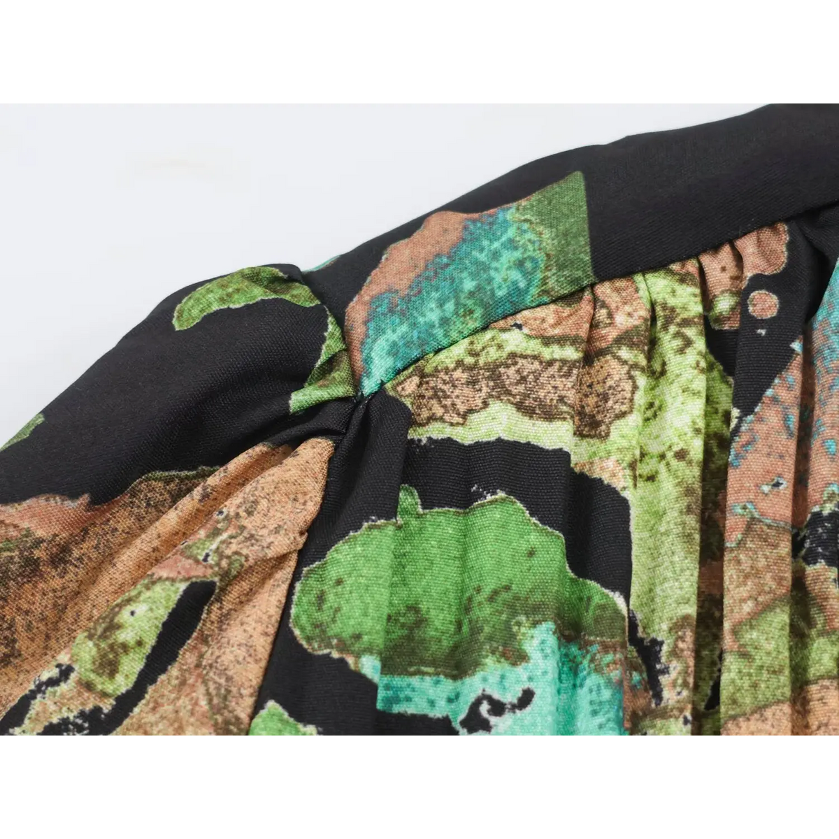 Close-up of shoulder gather and floral print fabric