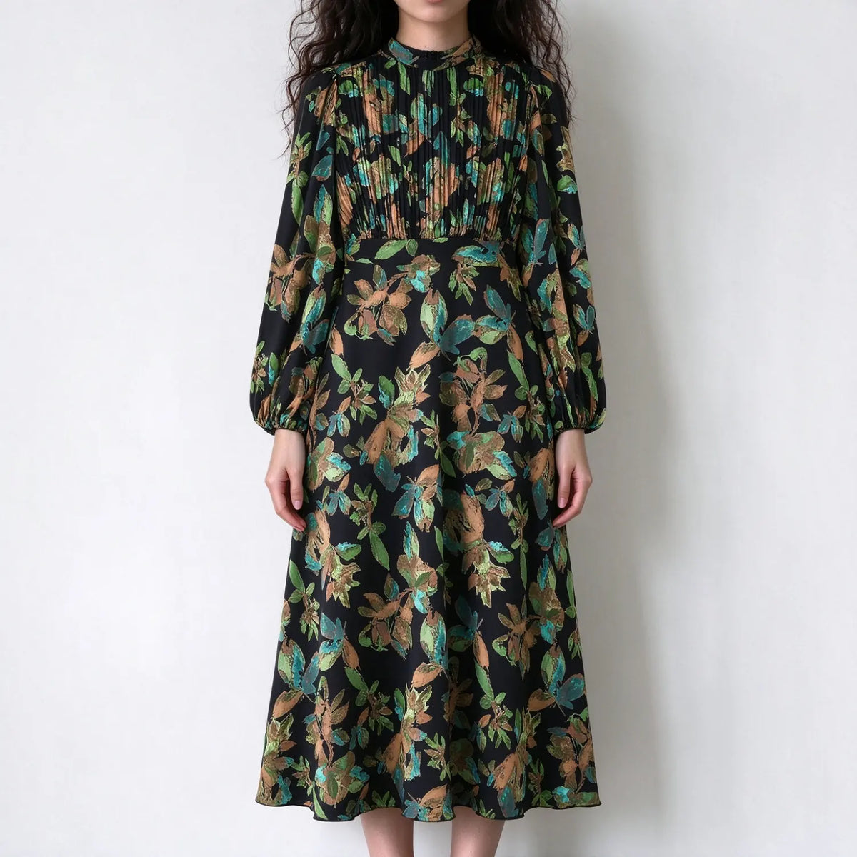 Model wearing painterly floral print pleated bodice midi dress, front view