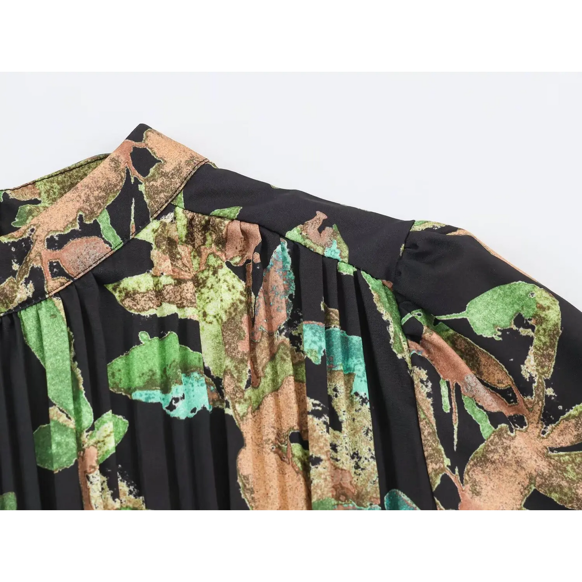 Close-up of shoulder seam and gathered pleats