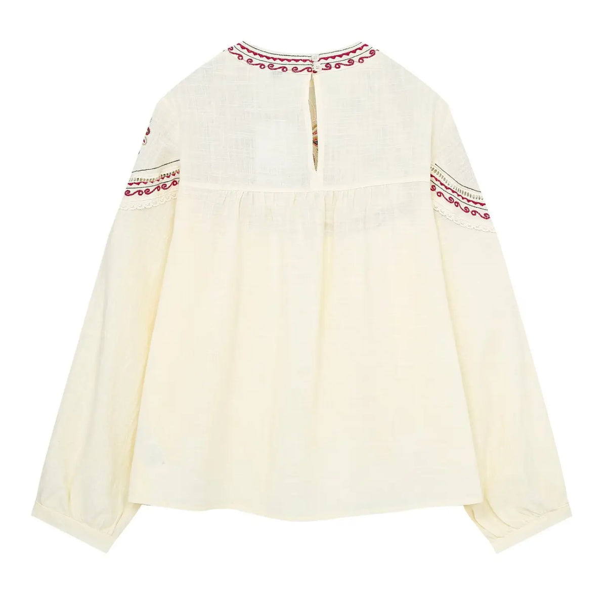 Back flat lay of embroidered blouse with back neck button closure