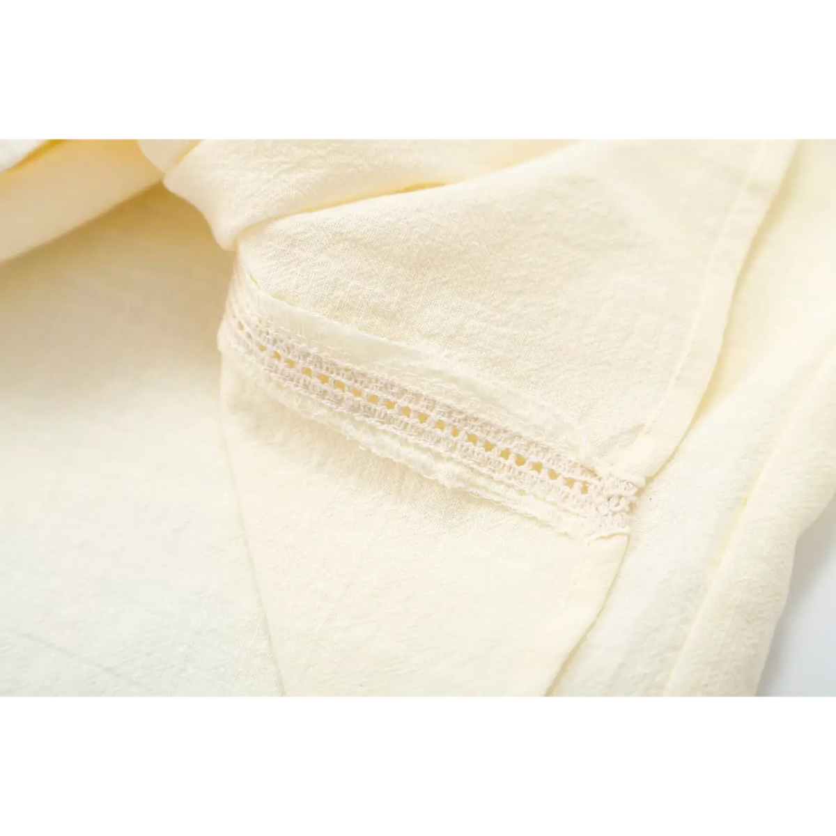 Close-up of side ladder lace trim