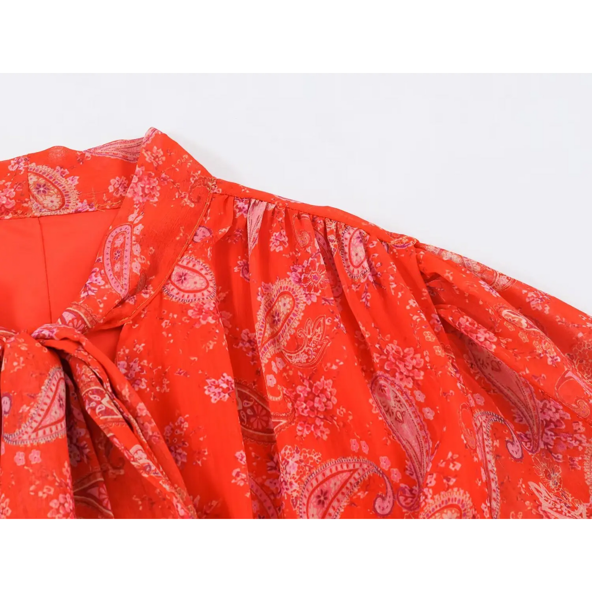 Shoulder gather closeup of paisley print maxi dress, showing neckline stitching and allover vintage print