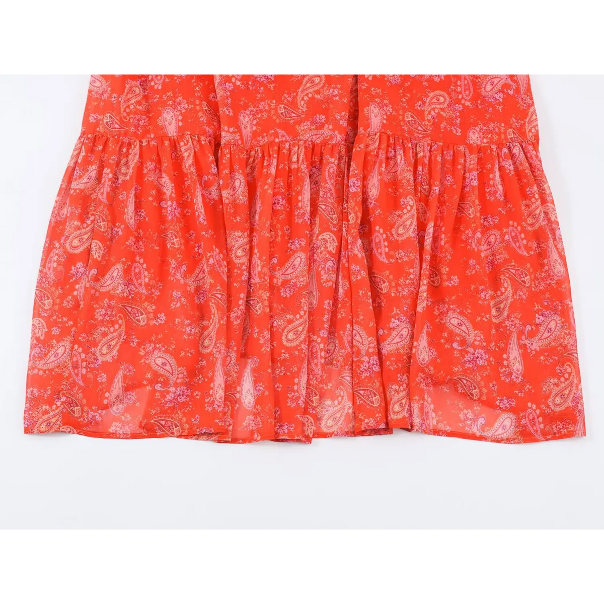 Full view of tiered ruffle skirt of paisley print maxi dress, flowy semi-sheer fabric with vintage paisley floral pattern