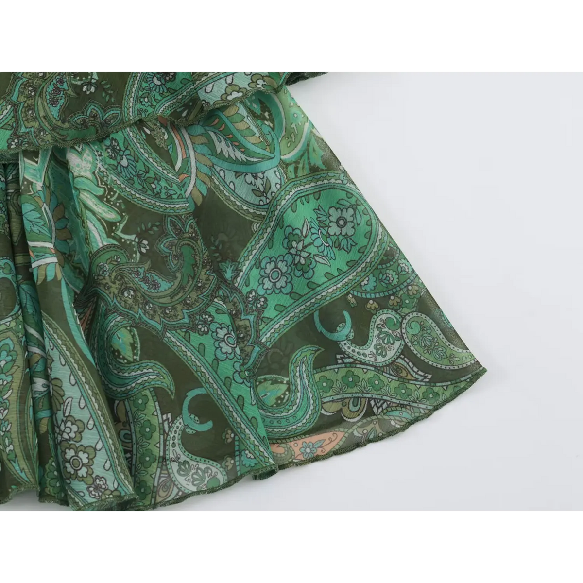 Close-up of skirt hem edge and paisley print