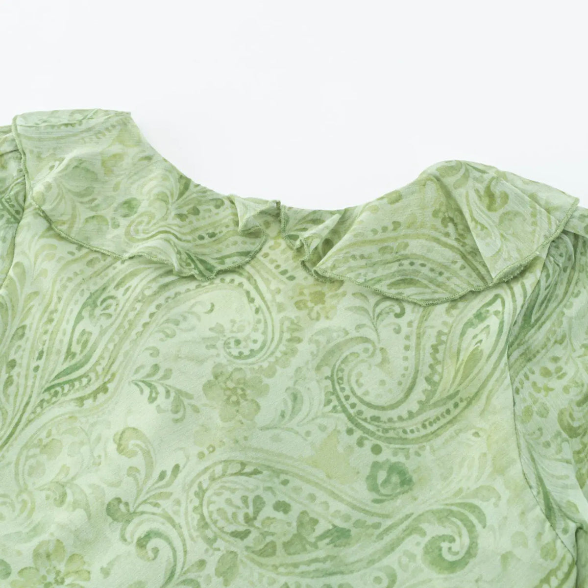 Close-up of back neck ruffle detail