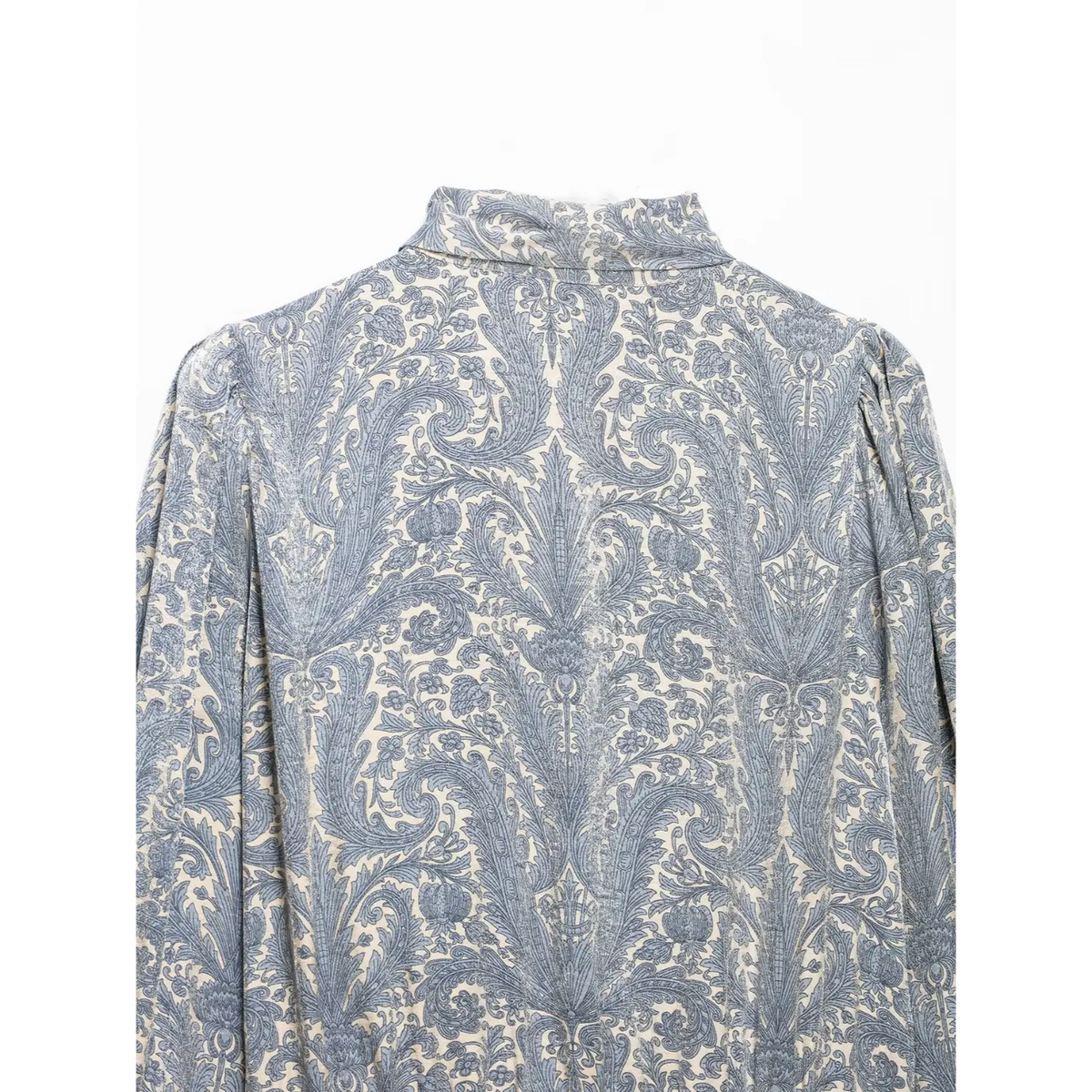Close-up of back neckline and puff shoulders