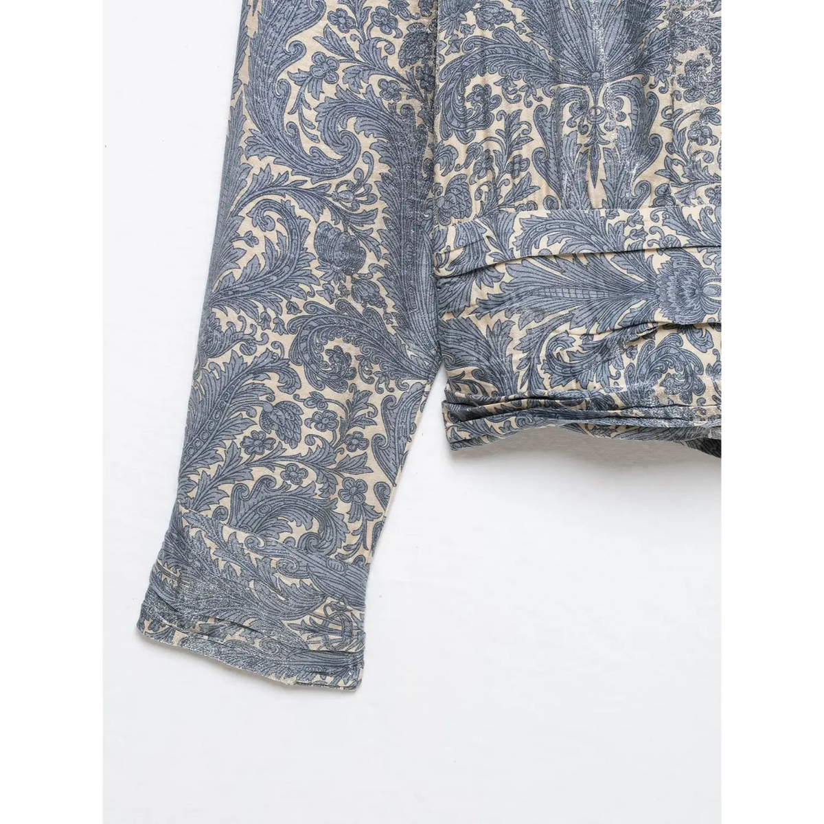 Close-up of ruched waist and cuff detail