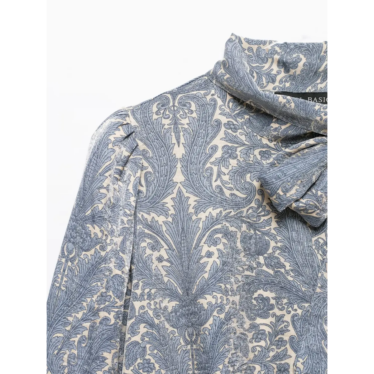 Close-up of shoulder bow tie and puff sleeve